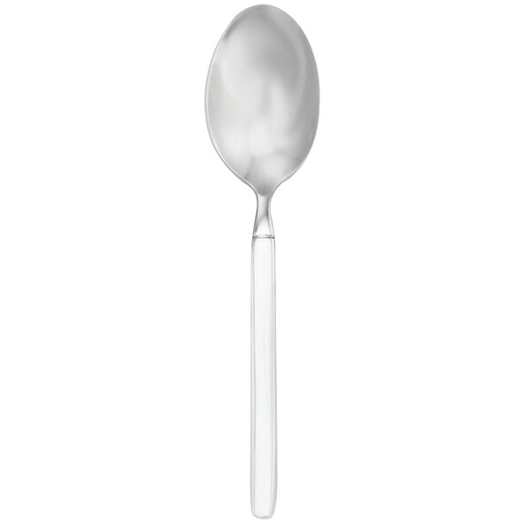 A Walco stainless steel teaspoon with a white handle and silver spoon.