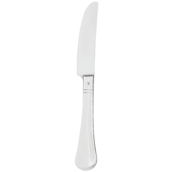 A silver Walco European table knife with a black handle.