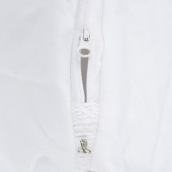 A white JT Eaton Twin XL bed bug mattress cover with a zipper.