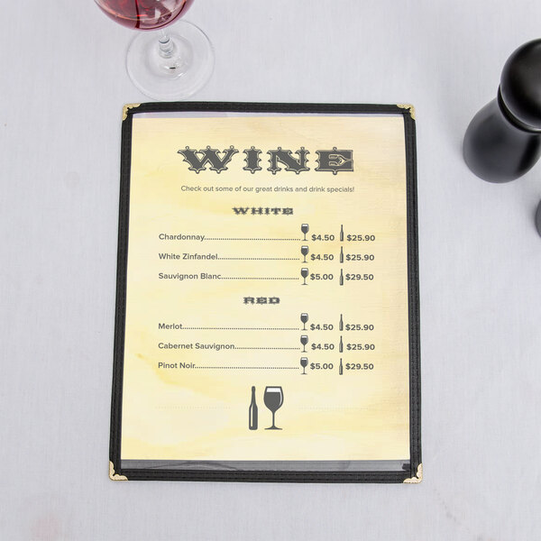 a menu with price list and wine glasses