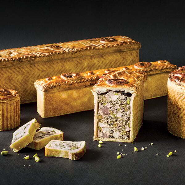 A close up of a variety of baked food in a Matfer Bourgeat non-stick pate mold.