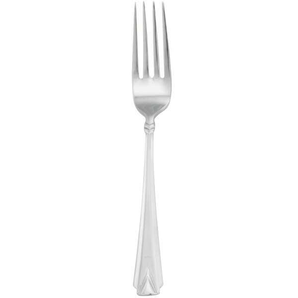 A silver Walco Athenian dinner fork with a white background.