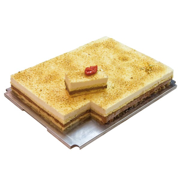 A rectangular cake with a red pepper on top in a Matfer Bourgeat red mousse frame.