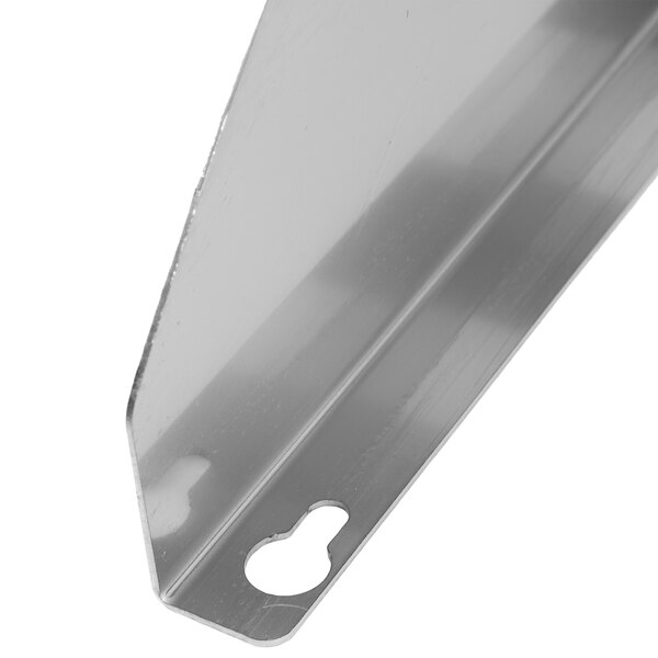 A stainless steel Matfer Bourgeat wall mounted utensil rack with a shelf.