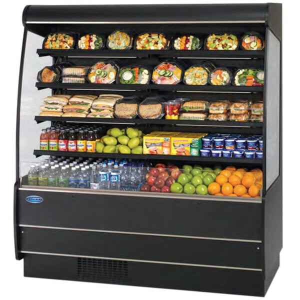 A black Federal Industries air curtain merchandiser with shelves of food including green fruit, blue containers, and plastic bottles.