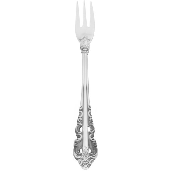 A silver Walco Classic Baroque cocktail fork with a floral design.