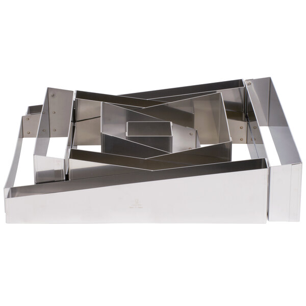 A Matfer Bourgeat stainless steel rectangular wedding cake ring set.