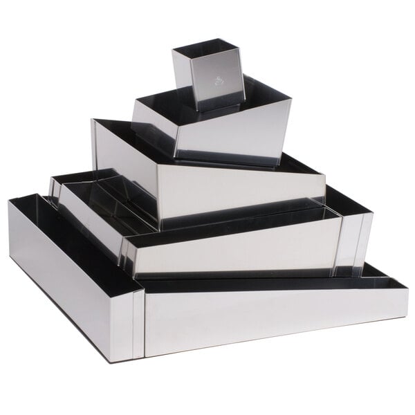 A silver Matfer Bourgeat stainless steel cake ring set on a black surface.