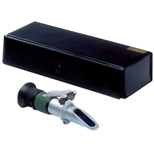 A white rectangular box with a green and black label and a silver and green Matfer Bourgeat Refractometer.