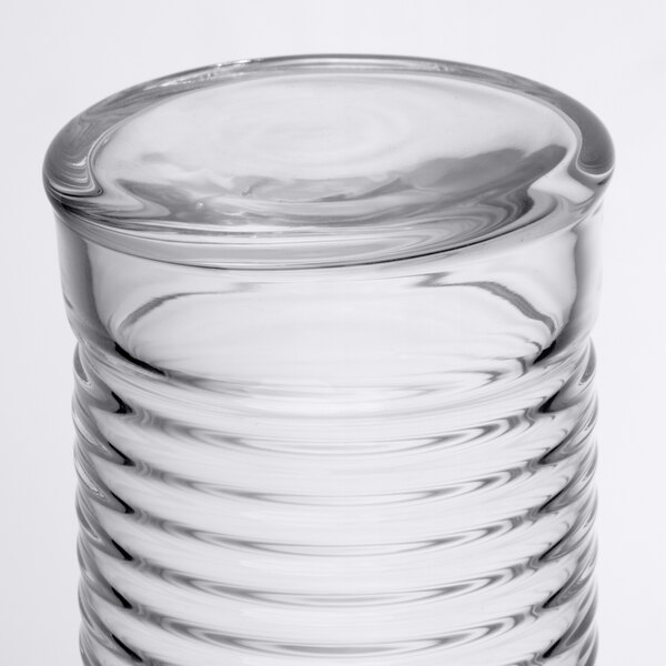 An Arcoroc clear glass highball with a spiral design.