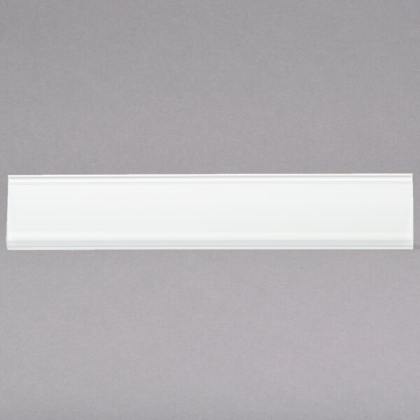 A white rectangular object with a grey background.