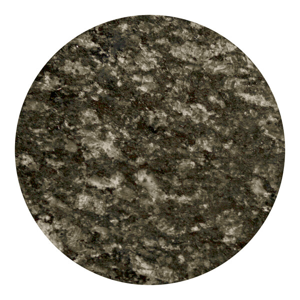 A close-up of a round black and white Uba Tuba granite table top.