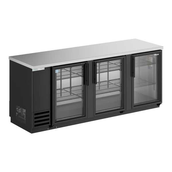 A black True back bar refrigerator with glass doors.