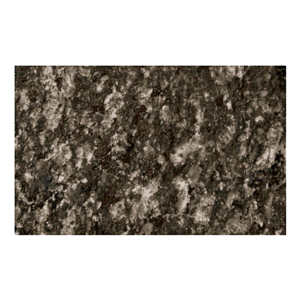 An Uba Tuba granite table top with a black and white speckled surface.