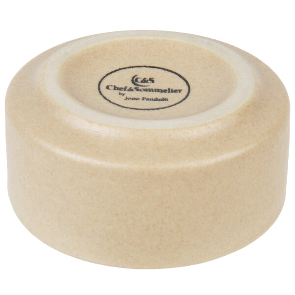 A gray stackable stoneware ramekin with a close-up of a bowl.