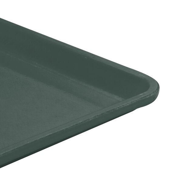 A slate blue Cambro dietary tray on a table.