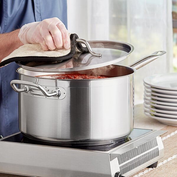 Aluminum-clad bottom saucepan simmering marinara sauce