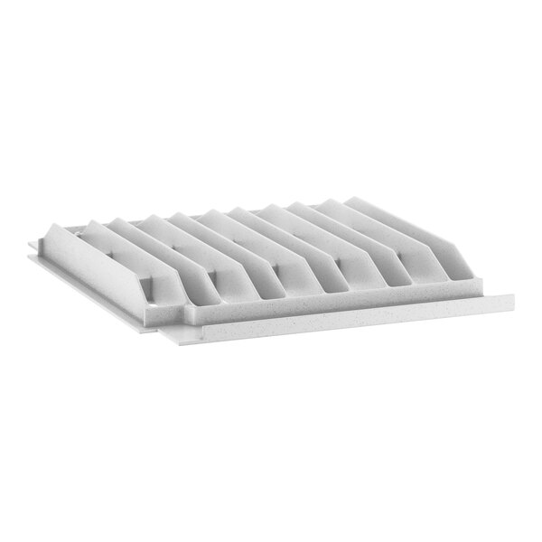 A white plastic shelf end plate with a grid of holes.