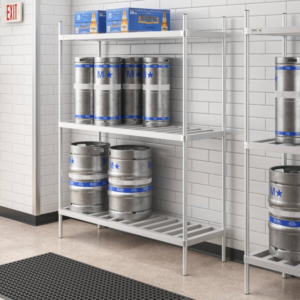 A Regency aluminum keg rack holding six kegs on metal shelves.