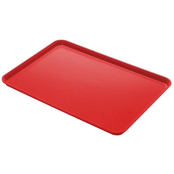A rose red Cambro Camlite tray on a counter.
