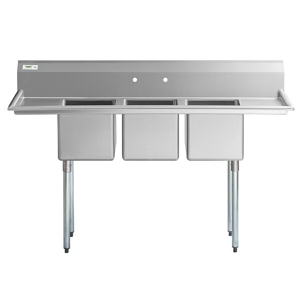 A Regency stainless steel three compartment sink with two drainboards.