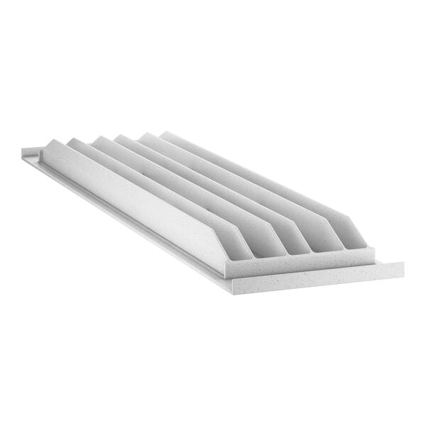 A white rectangular shelf with rows of white vents.