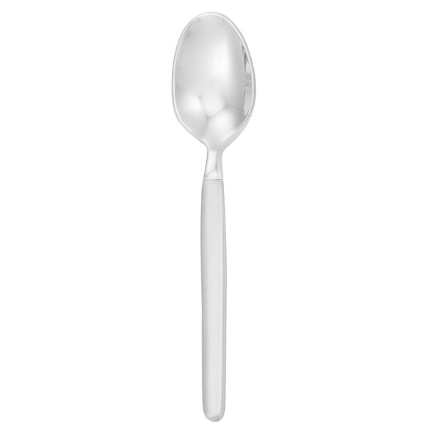 A Walco stainless steel demitasse spoon with a frosted white handle.