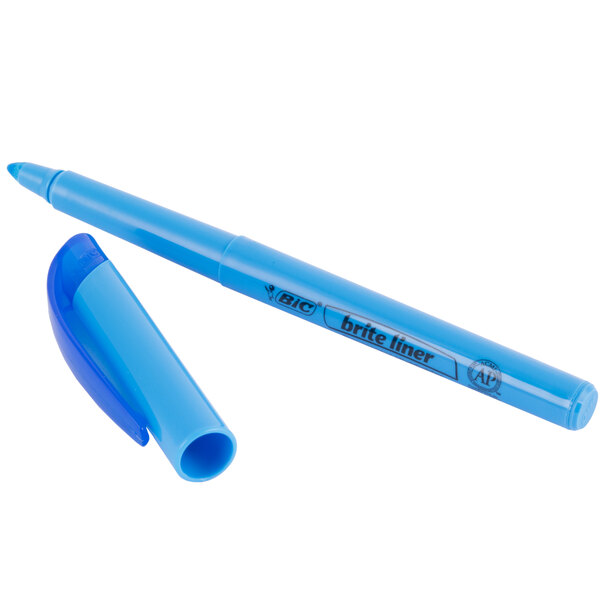 A close-up of a Bic Brite Liner Fluorescent Blue highlighter pen and cap.