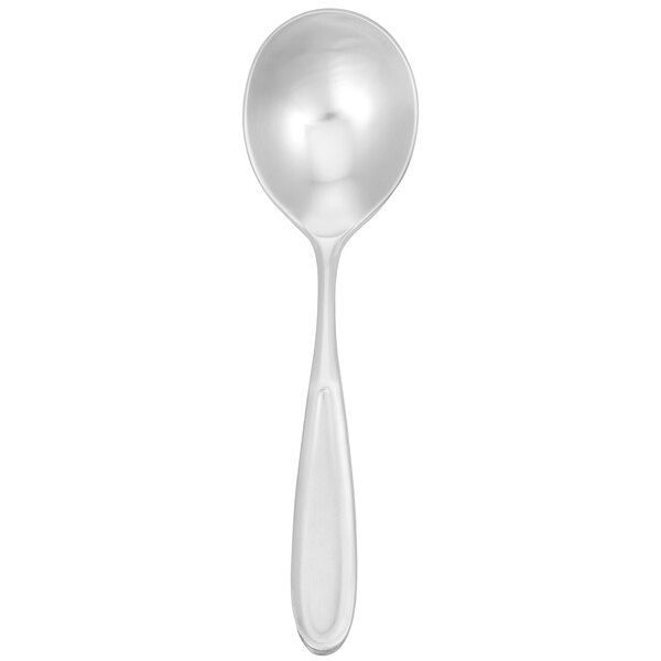 A Walco stainless steel bouillon spoon with a white handle.