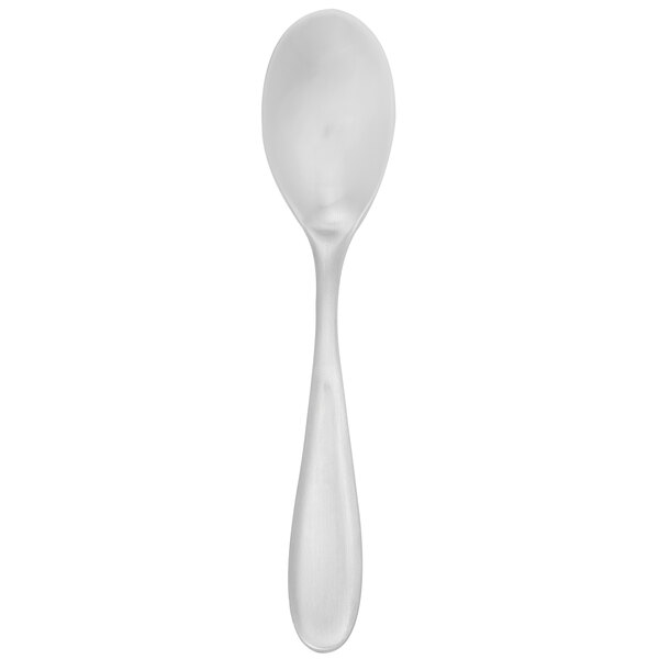 A Walco stainless steel demitasse spoon with a white handle.