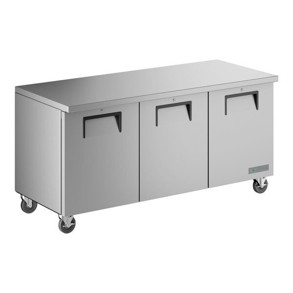 A stainless steel undercounter refrigerator with three doors and caster wheels.