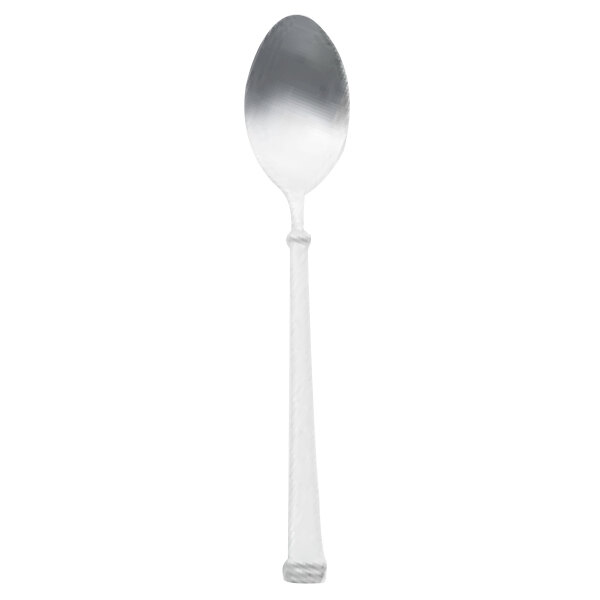 A Walco Farmington stainless steel teaspoon with a white handle and silver spoon on a white background.