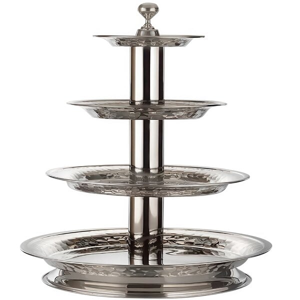A stainless steel Bon Chef 4-tier stand on a table outdoors.