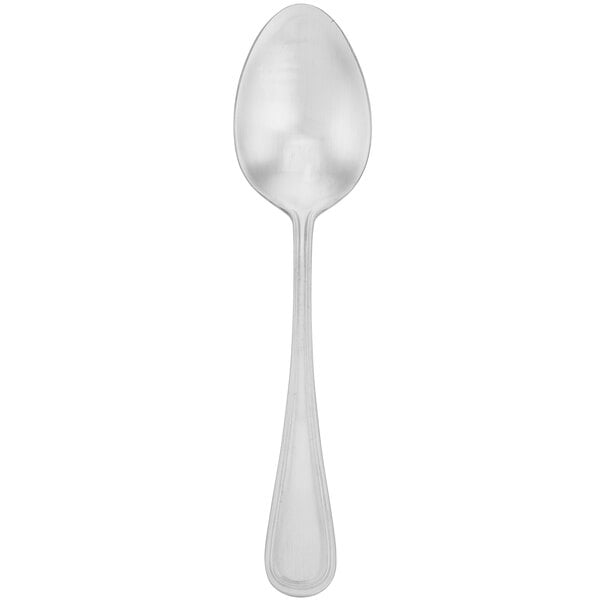 A silver Walco 18/10 stainless steel dessert spoon with a white handle.