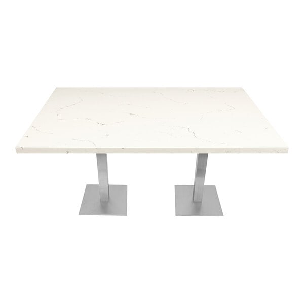 An Art Marble Furniture Carrera White Quartz table top on a table with silver legs.