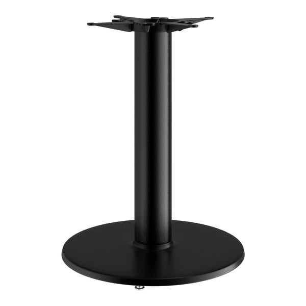 A Lancaster Table & Seating black cast iron round table base with a black pole and round base.