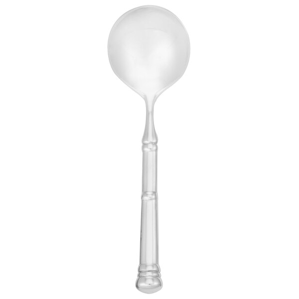 A close-up of a Walco stainless steel bouillon spoon with a white background.