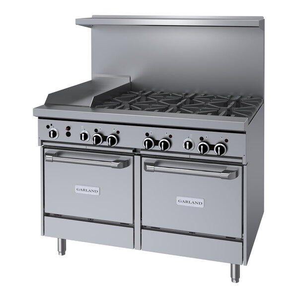 A stainless steel Garland commercial gas range with 6 burners and 12" griddle over 2 ovens.