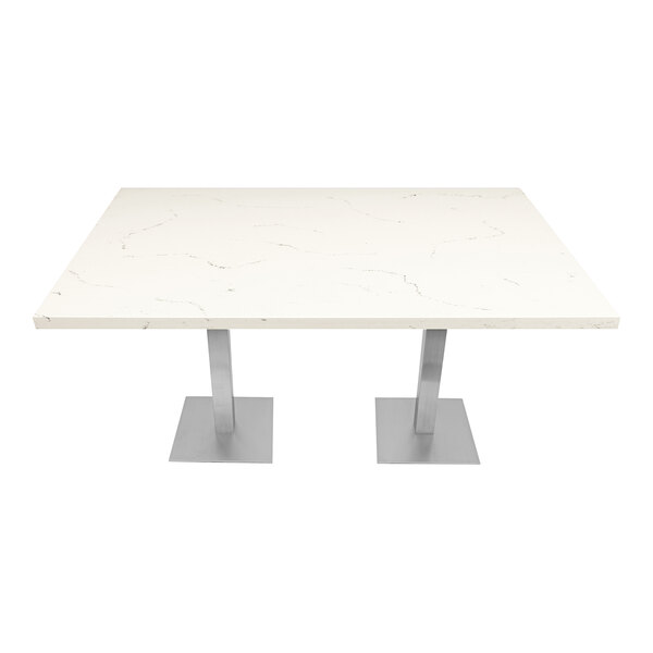 An Art Marble Furniture Carrera White Quartz table top on a table with silver legs.