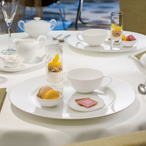 A table set with Villeroy & Boch white bone porcelain platters and cups.