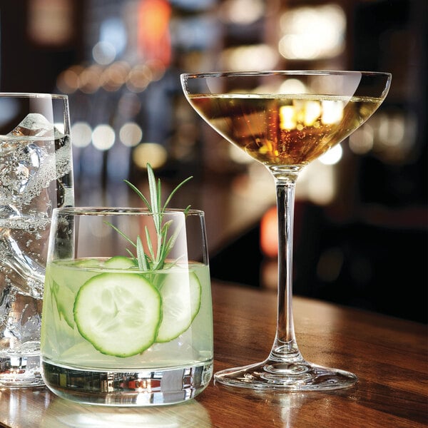 A Chef & Sommelier Sequence Coupe Glass filled with liquid on a table.