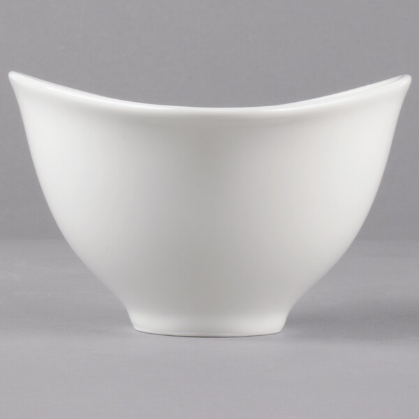 A white Villeroy & Boch Dune porcelain bowl with a curved edge.