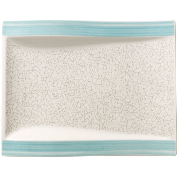 A white rectangular porcelain plate with a blue crackled design.