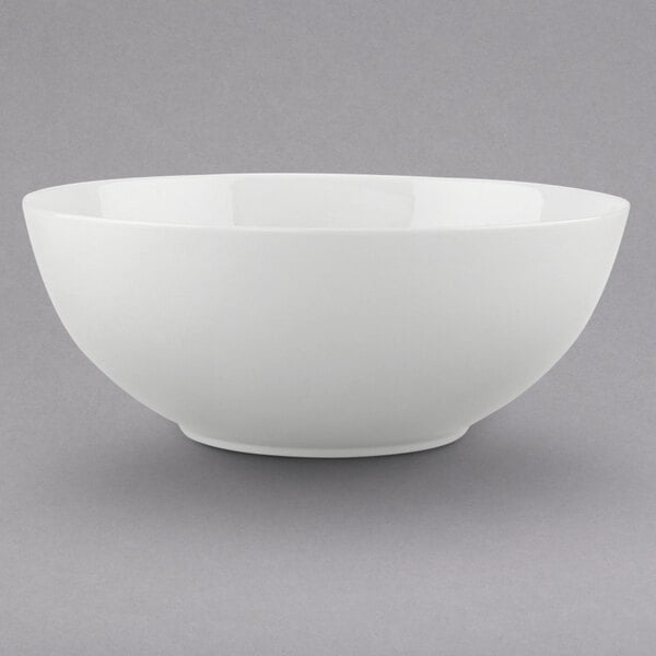 A Villeroy & Boch white bone porcelain bowl on a gray surface.