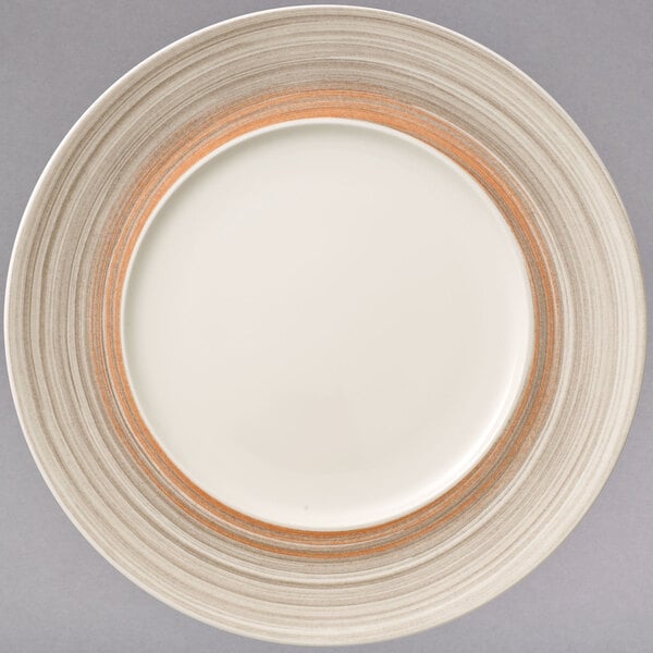 A taupe porcelain coupe plate with a white rim.