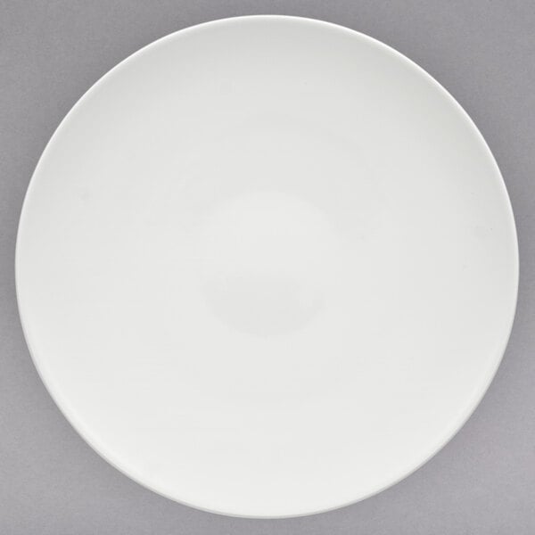 A white Villeroy & Boch porcelain plate with a small rim and a circle in the middle.