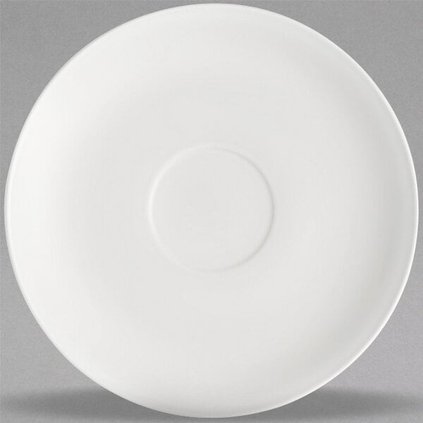 A white Villeroy & Boch bone porcelain saucer with a circle on it.