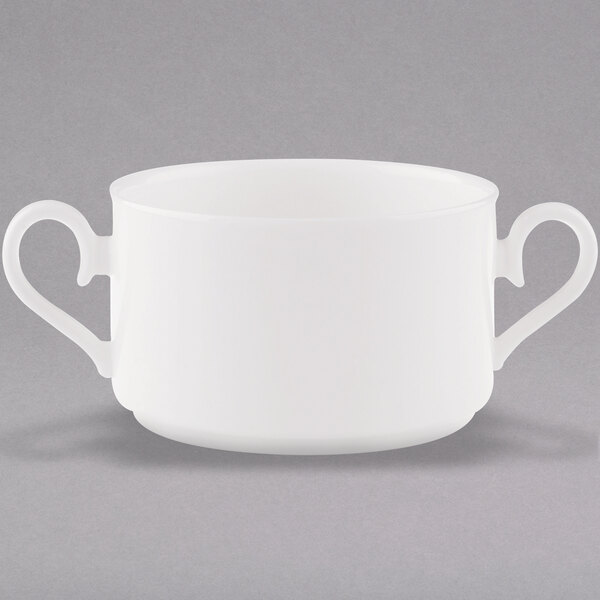 A white bowl with two handles.