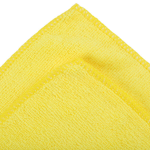 A yellow microfiber cloth with white stitching.