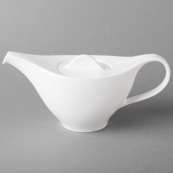 A white Villeroy & Boch porcelain teapot with a lid and a handle.